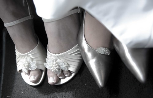 Close up of bride and bridesmaid wearing high heels