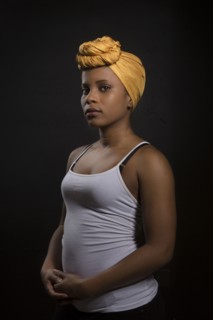 Serious Black woman wearing headwrap