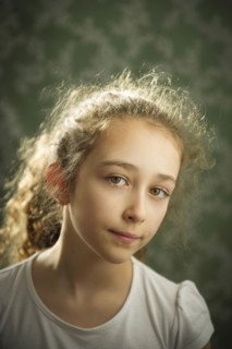 Close up of somber Caucasian girl