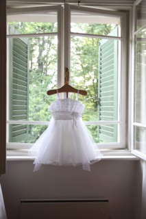Formal dress hanging in window
