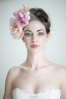 Caucasian bride wearing flower in hair