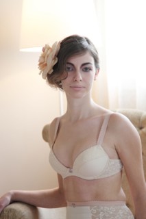 Caucasian woman in lingerie wearing flower in her hair