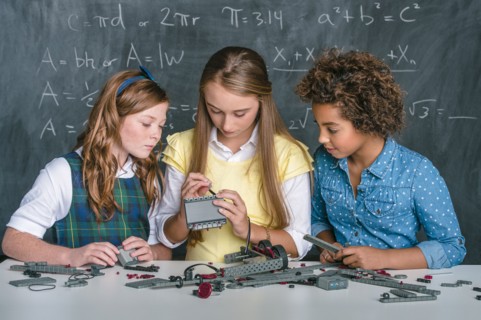 Students building vehicle in science class