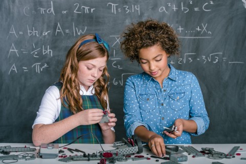 Students building vehicle in science class