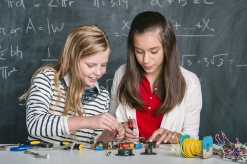 Students building vehicle in science class