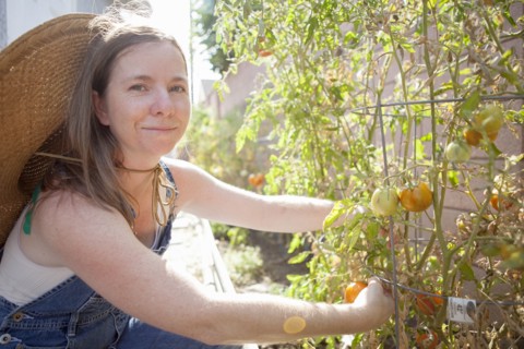 Mixed race farmer working in garden