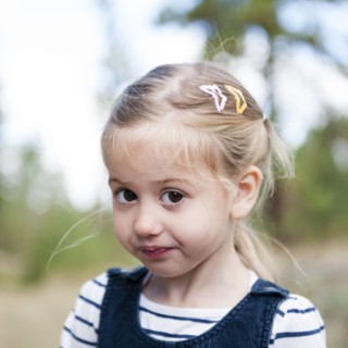 Close up of serious Caucasian girl on hillside