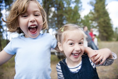 Close up of Caucasian sisters hugging outdoors