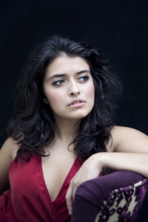 Mixed race woman leaning on armchair