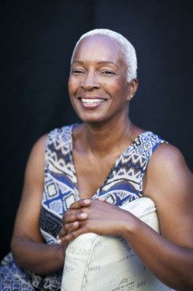 Smiling woman leaning on chair back
