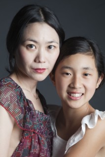 Asian mother and daughter hugging