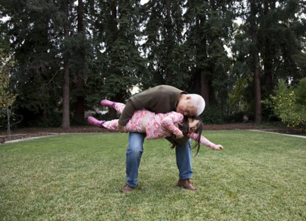 Father and daughter playing in backyard