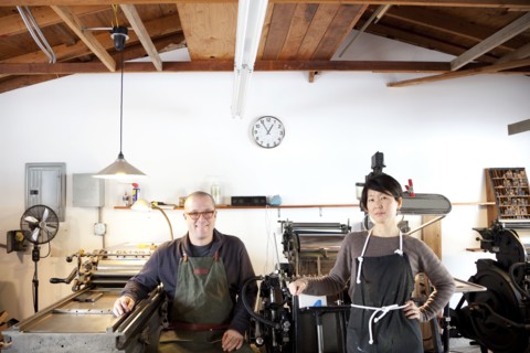 Entrepreneurs smiling in print shop