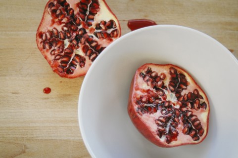 Close up of halved pomegranate on plate