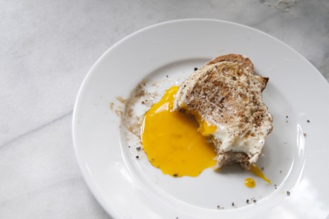 Close up of toast and runny egg yolk breakfast