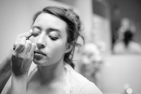 Teenage girl having makeup applied