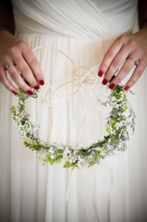Caucasian bride holding flower headband