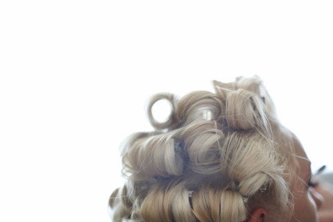 Close up of hair of Caucasian woman in rollers
