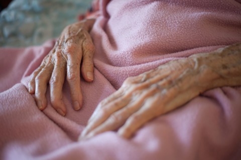Close up of wrinkled hands of senior woman