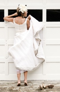 Bride peeking inside garage window