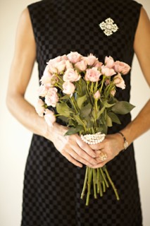 Woman holding bouquet of flowers