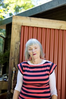 Older Caucasian woman standing in backyard