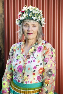 Stylish older Caucasian woman wearing floral cap