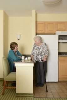Caucasian older women relaxing in kitchen