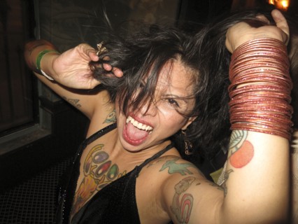 Asian woman dancing at party