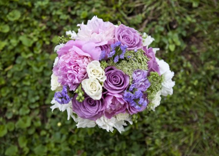 Close up of bouquet of flowers in grass