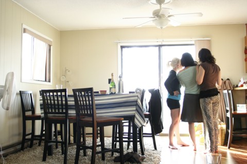 Women standing in dining room