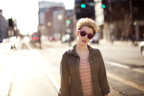 Woman standing in city intersection