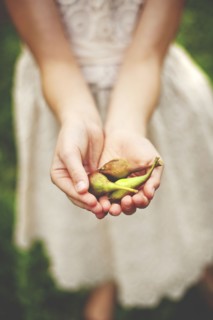Close up of woman girl seed pods