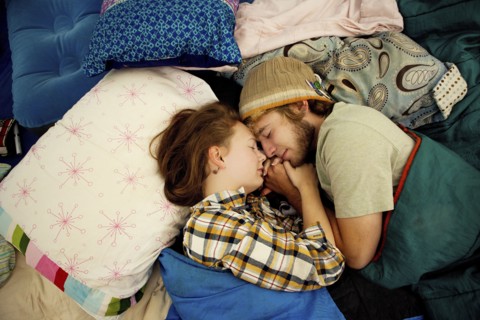 Couple sleeping in camping tent