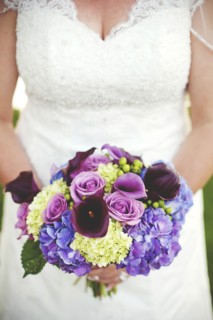 Close up of bride holding wedding bouquet