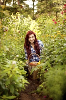 Gardener weeding plants in backyard