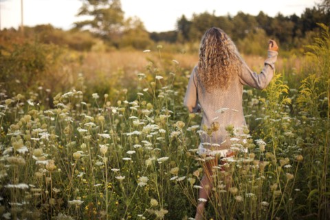 Woman walking in rural field