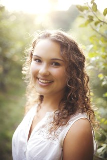 Smiling woman standing outdoors