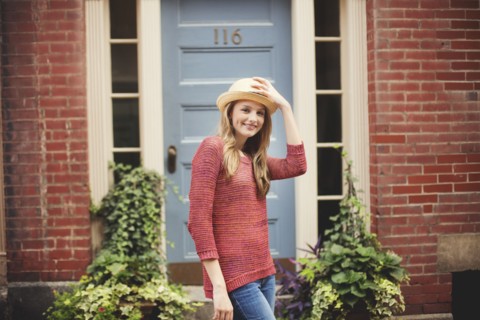 Smiling girl standing near doorway