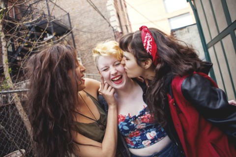Friends playing in city
