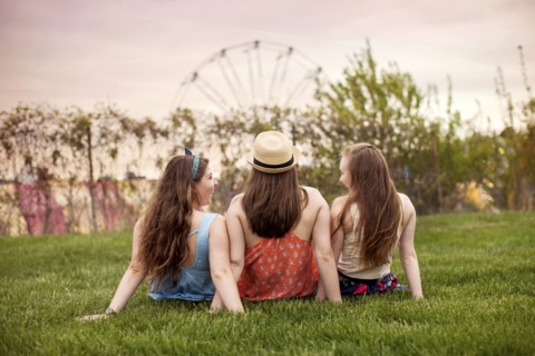 Caucasian women sitting in urban park