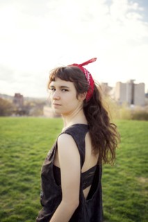 Caucasian woman standing in urban park