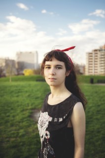 Caucasian woman standing in urban park