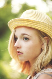 Close up of Caucasian woman wearing straw hat