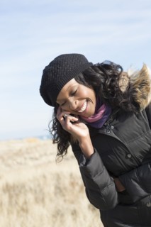 Close up of woman talking on cell phone outdoors