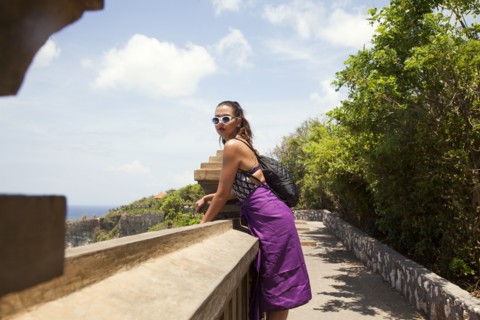 Woman admiring view from hillside path