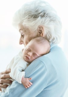 Close up of grandmother holding grandson