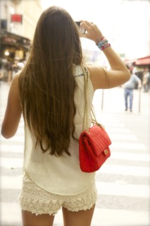 Rear view of woman taking photographs