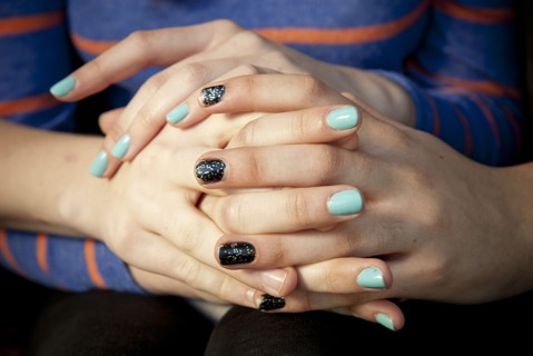 Close up of women holding hands