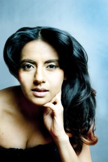 Indian woman resting chin in hand